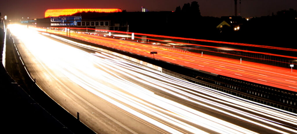 Light trails created by a long exposure photo of a highway