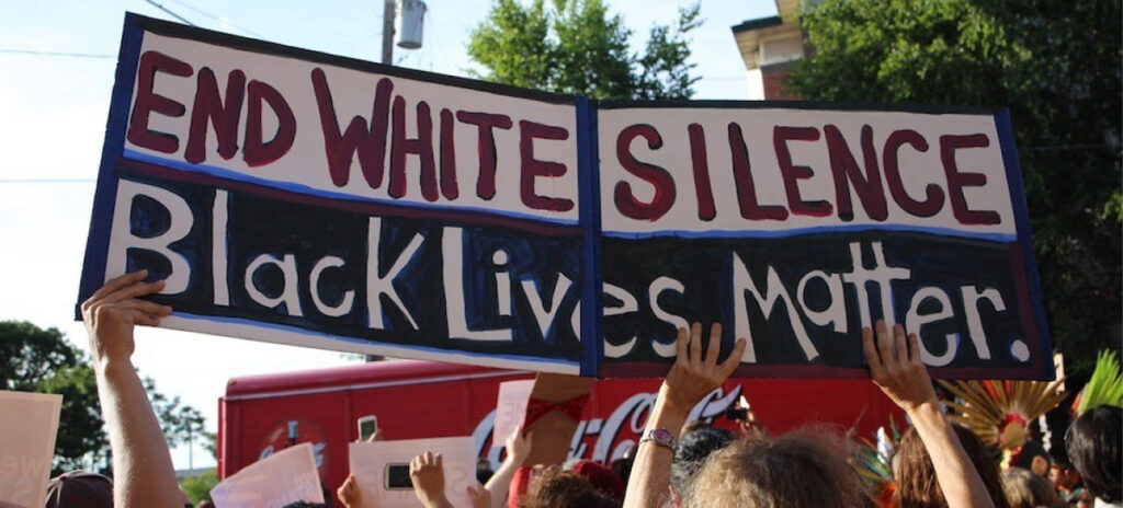 Black Lives Matter activists holding a sign
