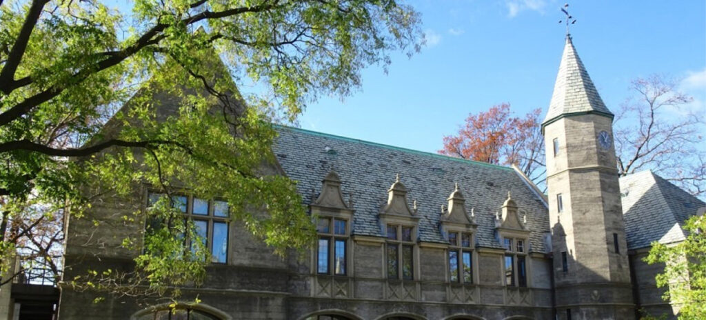 Fancy stone building with a slate roof and a turret