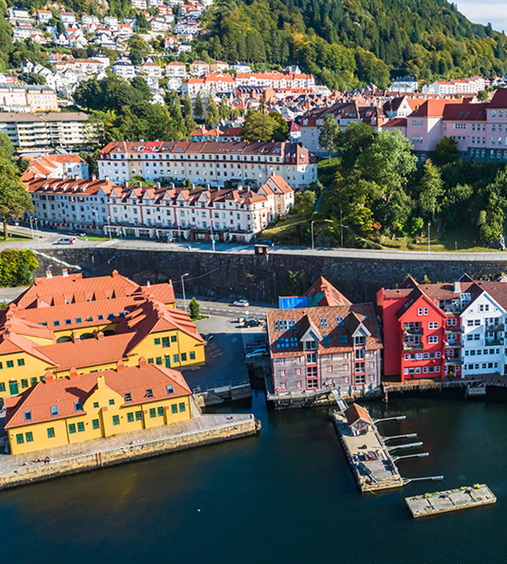 Aerial photo of a picturesque Scandinavian coast with colorful buildings