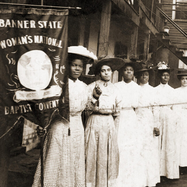 Black and white historical photo of suffragettes