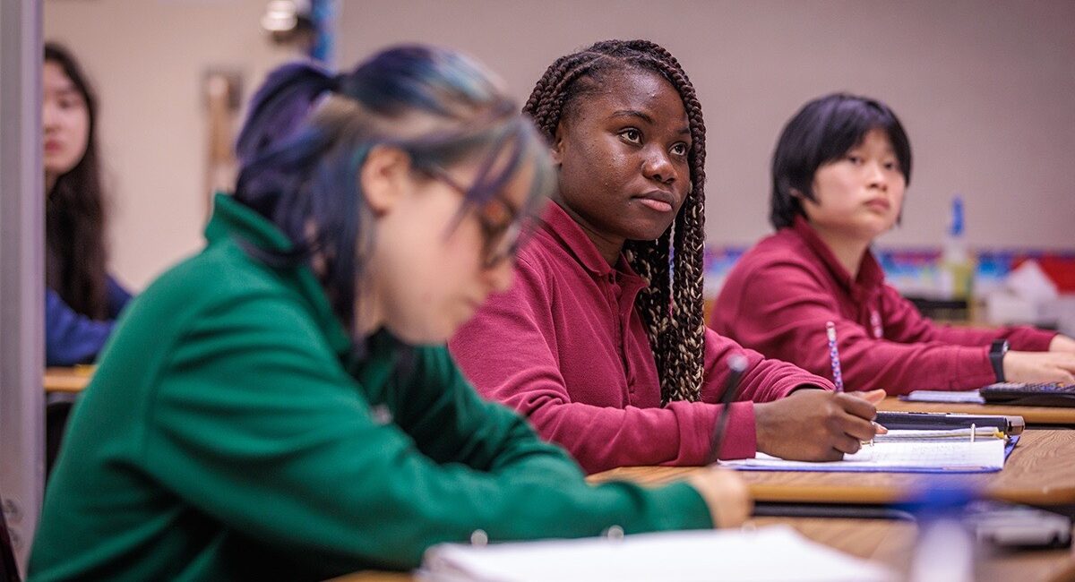 Four students in a classroom