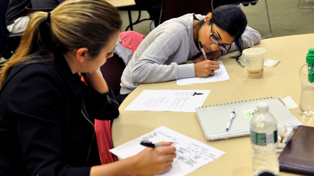Participants sketching ideas in a Design Studio workshop